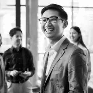 a man in a suit smiling