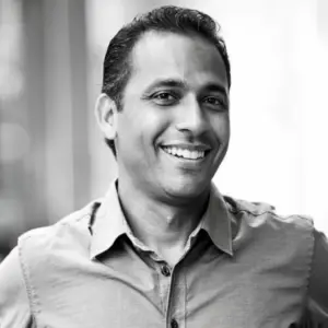 a man smiling at the camera